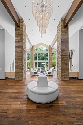 Chandelier, Dining room, Fireplace, Interior, Recessed Lighting, Stone Walls, Wooden Beams, Wood Texture Flooring
