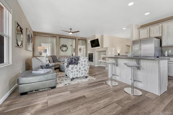 Fireplace, Interior, Kitchen, Living room, Recessed Lighting, Stainless Steel Appliances, Wood Texture Flooring