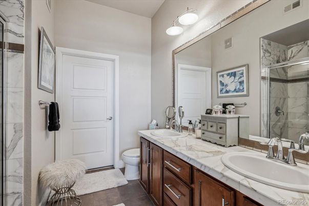 Bathroom, Dual Sink Vanities, Glass Shower, Interior, Marble Walls, Tile Countertops