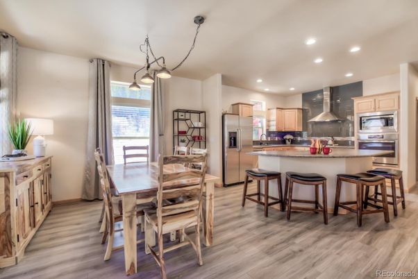 Dining room, Interior, Kitchen, Pendant Lights, Recessed Lighting, Stainless Steel Appliances, Wood Texture Flooring