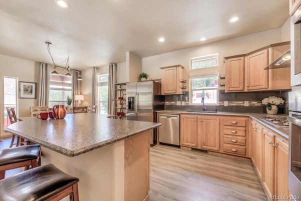Dining room, Interior, Kitchen, Pendant Lights, Recessed Lighting, Stainless Steel Appliances, Wood Texture Flooring