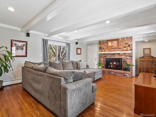 Fireplace, Interior, Living room, Recessed Lighting, Stone Walls, Wood Texture Flooring
