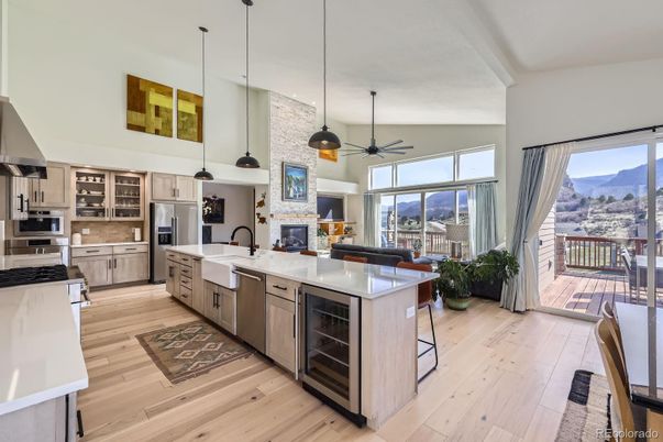 Fireplace, Interior, Kitchen, Pendant Lights, Stainless Steel Appliances, Wood Texture Flooring