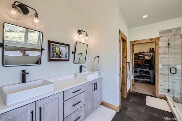 Bathroom, Dual Sink Vanities, Glass Shower, Interior, Recessed Lighting, Walk-in Closets, Wood Texture Flooring