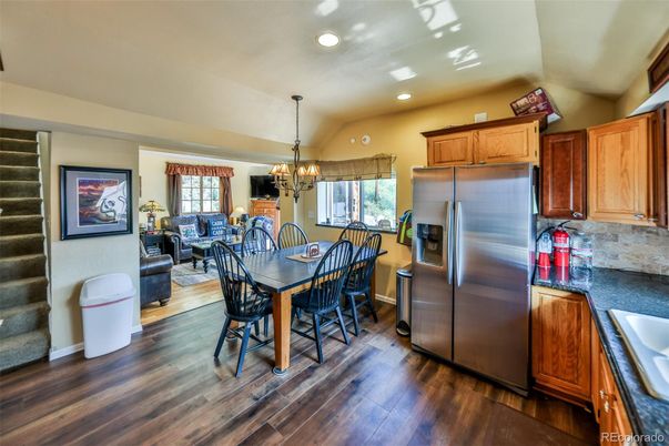 Chandelier, Dining room, Interior, Kitchen, Recessed Lighting, Stainless Steel Appliances, Wood Texture Flooring