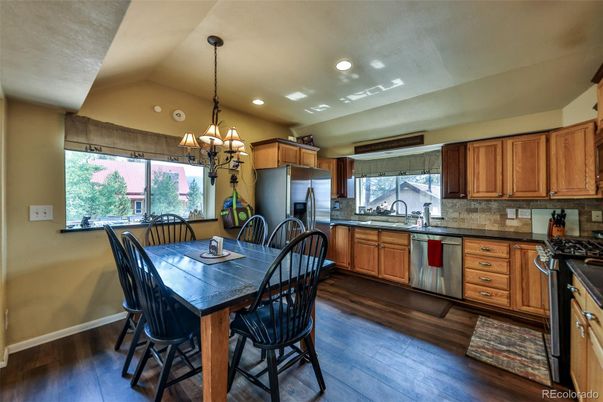 Chandelier, Dining room, Interior, Kitchen, Recessed Lighting, Stainless Steel Appliances, Wood Texture Flooring