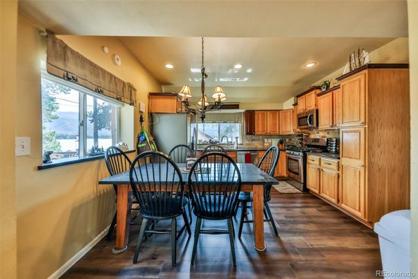 Chandelier, Dining room, Interior, Kitchen, Recessed Lighting, Stainless Steel Appliances, Wood Texture Flooring