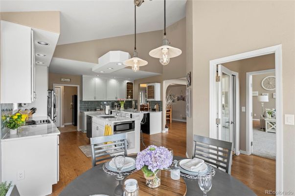 Dining room, Interior, Kitchen, Pendant Lights, Recessed Lighting, Stainless Steel Appliances, Wood Texture Flooring