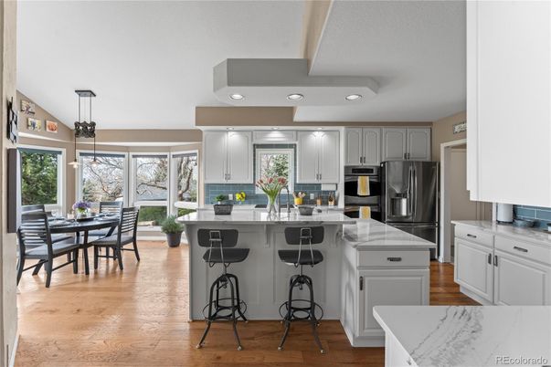 Dining room, Interior, Kitchen, Pendant Lights, Recessed Lighting, Stainless Steel Appliances, Wood Texture Flooring