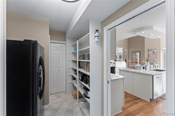 Interior, Kitchen, Marble, Recessed Lighting, Washer, Wood Texture Flooring