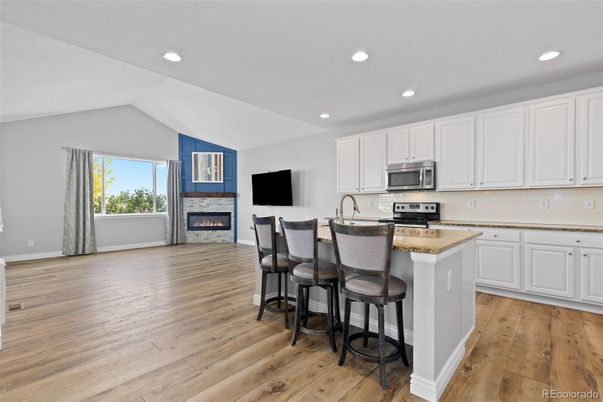 Fireplace, Interior, Kitchen, Recessed Lighting, Wood Texture Flooring