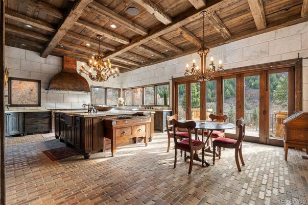 Chandelier, Dining room, Interior, Kitchen, Recessed Lighting, Stainless Steel Appliances, Stone Walls, Wooden Beams, Wooden Ceilings
