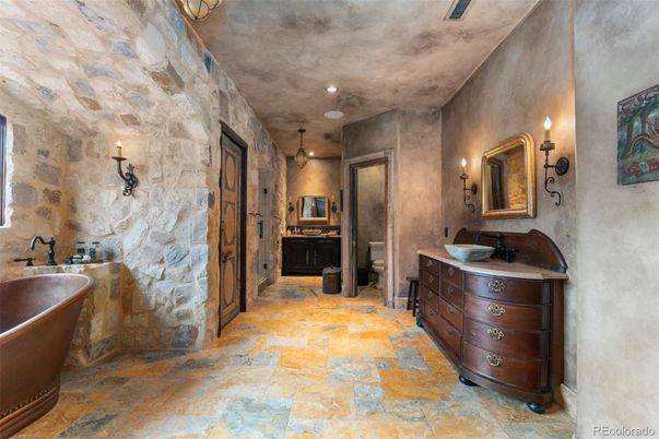 Bathroom, Dual Sink Vanities, Free Standing Baths, Interior, Recessed Lighting, Stone Walls