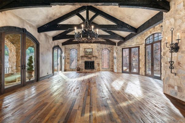 Chandelier, Empty room, Fireplace, Interior, Stone Walls, Wooden Beams, Wood Texture Flooring