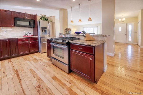 Chandelier, Interior, Kitchen, Pendant Lights, Recessed Lighting, Stainless Steel Appliances, Wood Texture Flooring