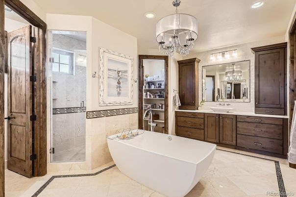 Bathroom, Chandelier, Dual Sink Vanities, Free Standing Baths, Glass Shower, Interior, Marble Walls, Recessed Lighting