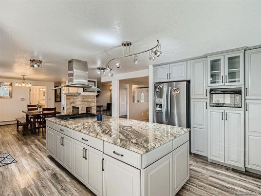Chandelier, Dining room, Interior, Kitchen, Stainless Steel Appliances, Wood Texture Flooring