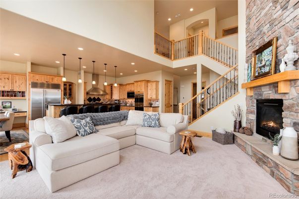 Fireplace, Interior, Kitchen, Living room, Pendant Lights, Recessed Lighting, Stainless Steel Appliances, Stone Walls