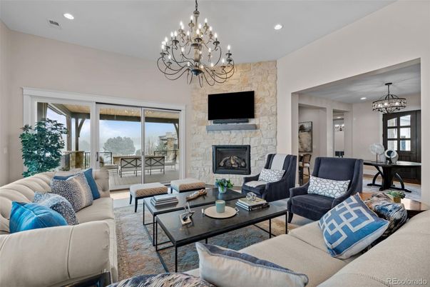 Chandelier, Dining room, Fireplace, Interior, Living room, Recessed Lighting, Stone Walls, Wood Texture Flooring