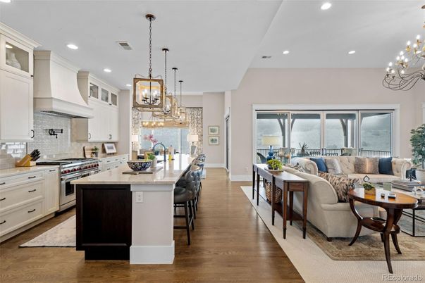 Chandelier, Interior, Kitchen, Living room, Pendant Lights, Recessed Lighting, Stainless Steel Appliances, Wood Texture Flooring