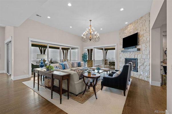 Chandelier, Dining room, Fireplace, Interior, Living room, Recessed Lighting, Stone Walls, Wood Texture Flooring