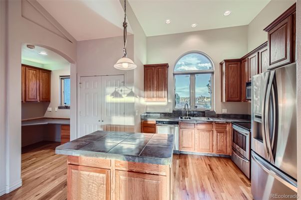 Interior, Kitchen, Pendant Lights, Recessed Lighting, Tile Countertops, Wood Texture Flooring