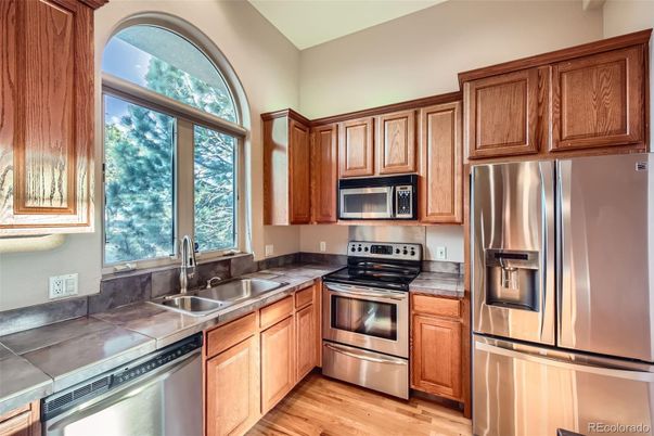 Interior, Kitchen, Stainless Steel Appliances, Tile Countertops, Wood Texture Flooring