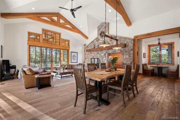 Dining room, Fireplace, Interior, Living room, Pendant Lights, Recessed Lighting, Stone Walls, Wooden Beams, Wood Texture Flooring
