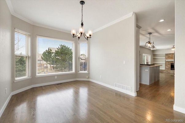 Chandelier, Empty room, Fireplace, Interior, Pendant Lights, Recessed Lighting, Wood Texture Flooring