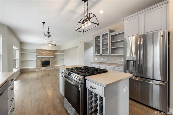 Fireplace, Interior, Kitchen, Pendant Lights, Recessed Lighting, Stainless Steel Appliances, Wood Texture Flooring