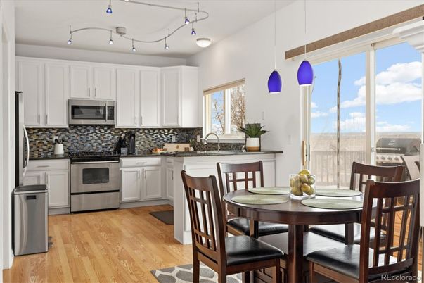 Dining room, Interior, Kitchen, Pendant Lights, Stainless Steel Appliances, Wood Texture Flooring