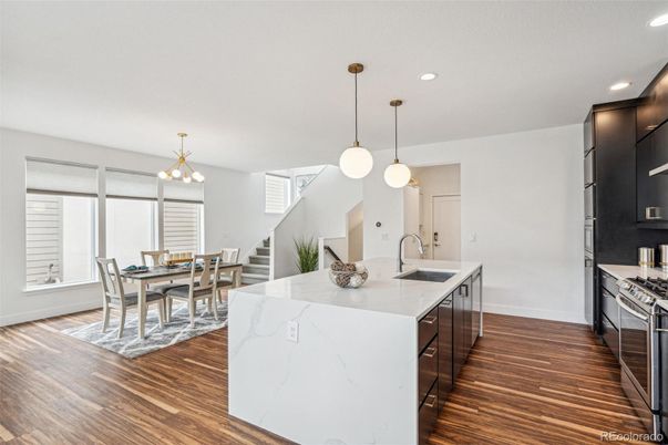 Dining room, Interior, Kitchen, Pendant Lights, Recessed Lighting, Stainless Steel Appliances, Wood Texture Flooring