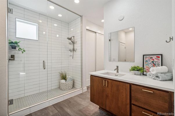 Bathroom, Dual Sink Vanities, Glass Shower, Interior, Recessed Lighting, Wood Texture Flooring