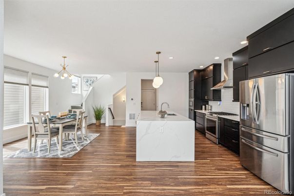 Dining room, Interior, Kitchen, Pendant Lights, Recessed Lighting, Stainless Steel Appliances, Wood Texture Flooring