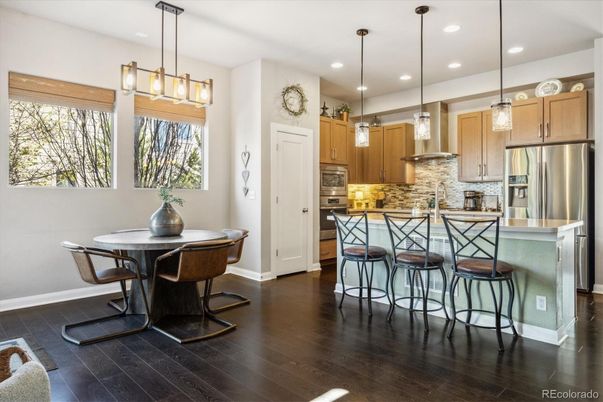Dining room, Interior, Kitchen, Pendant Lights, Recessed Lighting, Stainless Steel Appliances, Wood Texture Flooring