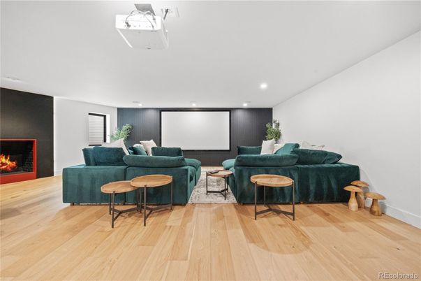 Fireplace, Interior, Living room, Projection Screen, Recessed Lighting, Wood Texture Flooring