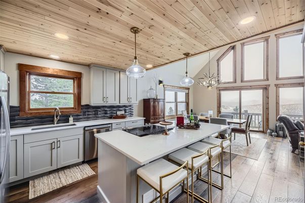 Dining room, Interior, Kitchen, Pendant Lights, Recessed Lighting, Stainless Steel Appliances, Wooden Ceilings, Wood Texture Flooring