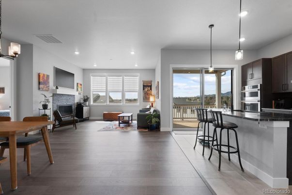 Dining room, Fireplace, Interior, Kitchen, Living room, Pendant Lights, Recessed Lighting, Stainless Steel Appliances, Wood Texture Flooring