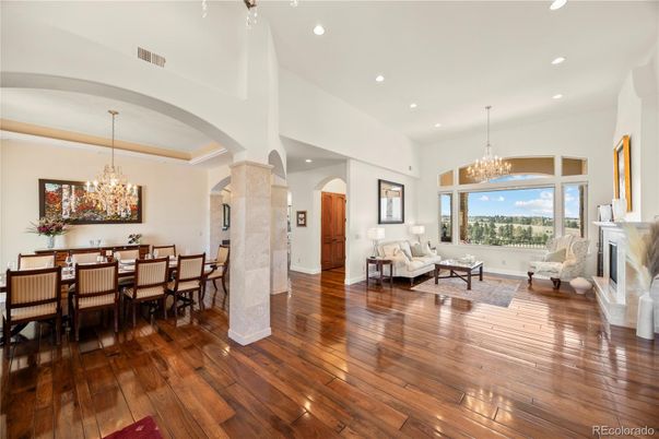 Chandelier, Dining room, Fireplace, Interior, Living room, Recessed Lighting, Wood Texture Flooring