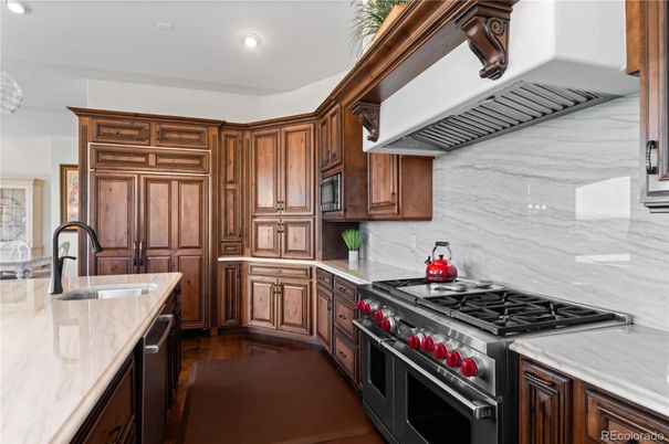 Interior, Kitchen, Marble Walls, Recessed Lighting, Stainless Steel Appliances, Wood Texture Flooring