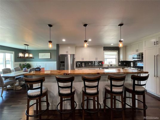 Dining room, Interior, Kitchen, Pendant Lights, Recessed Lighting, Stainless Steel Appliances, Wood Texture Flooring