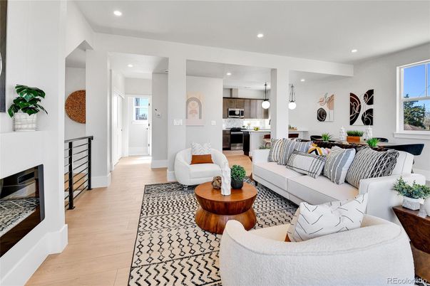 Fireplace, Interior, Kitchen, Living room, Pendant Lights, Recessed Lighting, Stainless Steel Appliances, Wood Texture Flooring