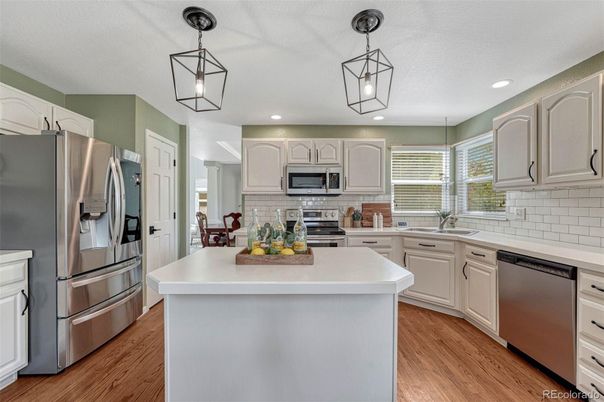 Interior, Kitchen, Pendant Lights, Recessed Lighting, Stainless Steel Appliances, Wood Texture Flooring