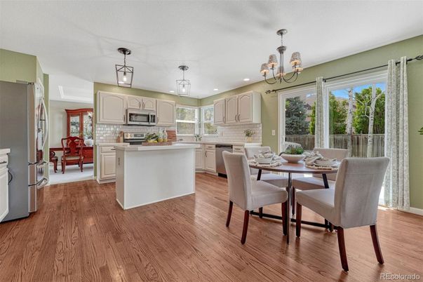 Chandelier, Dining room, Interior, Kitchen, Pendant Lights, Recessed Lighting, Stainless Steel Appliances, Wood Texture Flooring