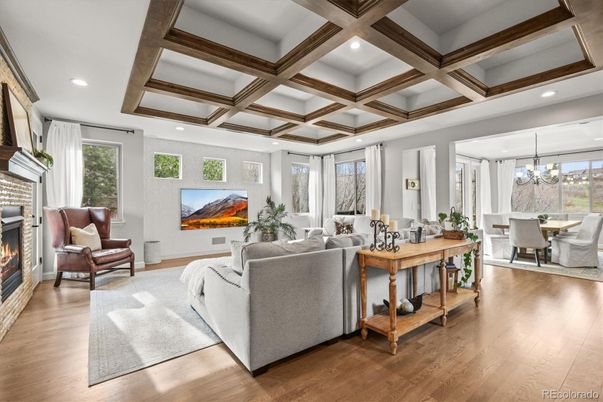 Chandelier, Dining room, Fireplace, Interior, Living room, Recessed Lighting, Wooden Beams, Wood Texture Flooring