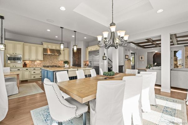 Chandelier, Dining room, Interior, Kitchen, Pendant Lights, Recessed Lighting, Stainless Steel Appliances, Wooden Beams, Wood Texture Flooring