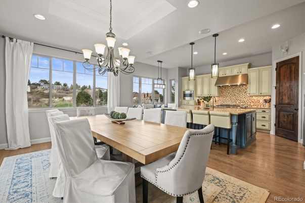Chandelier, Dining room, Interior, Kitchen, Pendant Lights, Recessed Lighting, Stainless Steel Appliances, Wood Texture Flooring