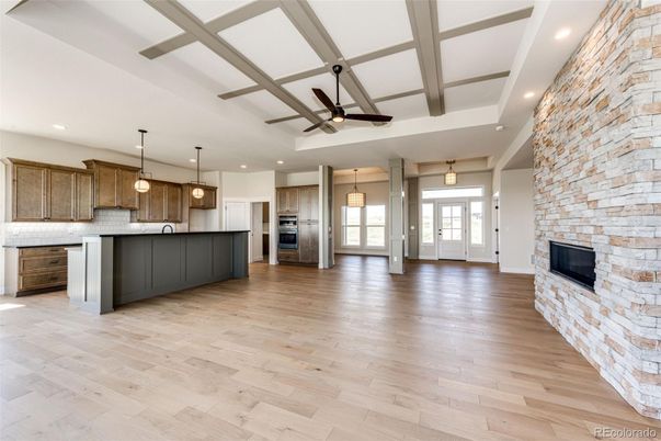Fireplace, Interior, Kitchen, Pendant Lights, Recessed Lighting, Stainless Steel Appliances, Stone Walls, Wooden Beams, Wood Texture Flooring