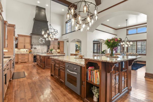 Chandelier, Dining room, Interior, Kitchen, Pendant Lights, Recessed Lighting, Stainless Steel Appliances, Wood Texture Flooring