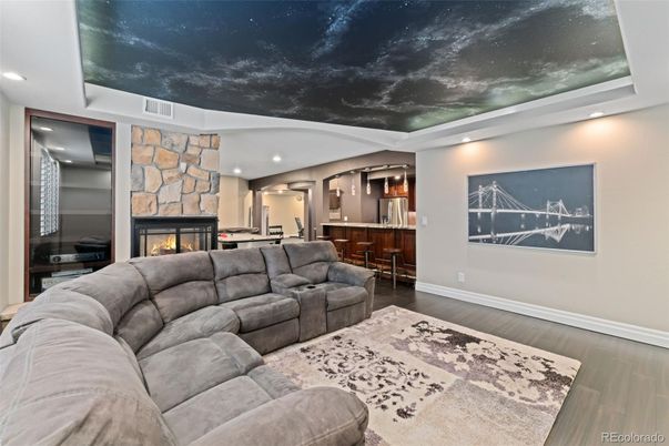Fireplace, Interior, Living room, Pendant Lights, Recessed Lighting, Stone Walls, Wood Texture Flooring